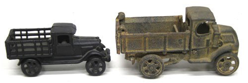 (2) CAST IRON TRUCKS: Cast iron dump truck, (1) C-Cab Mack dump, rusty; (1) stake body with repaint; L-6"-8", F