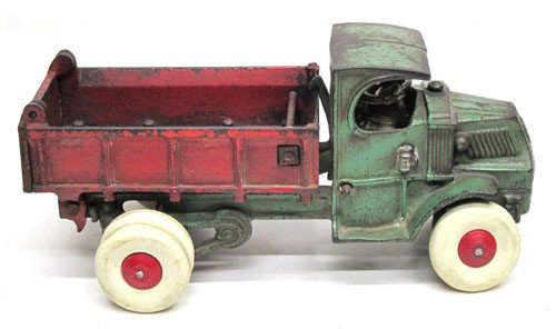HUBLEY MACK DUMP TRUCK: Painted cast iron green truck, red box; paint loss with minor rust; new tires; L-10 3/4", G-VG