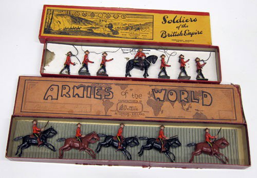 (2) BRITAINS BOXED FIGURES: #1554 Royal Canadian Mounted Police (7) pieces, original box, original tie-downs; #1349 North West Mounted Police (5) pieces; original box; loose in box; flaking; box wear and tear; G-VG