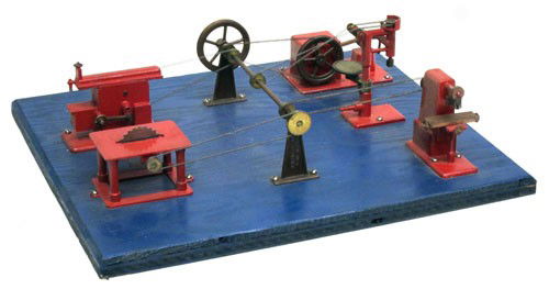 JENSEN WORKSHOP: Includes: shaper, drill press, table saw, milling machine, trip hammer; metal pieces on wooden base; painted; U.S.A., some paint loss; H-4 1/2", 13 3/4" x 12", VG
