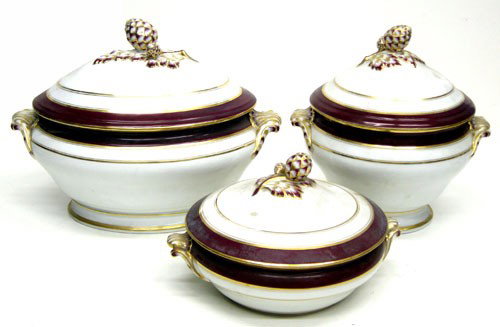 PORCELAIN DINNER SERVICE: Partial set of 57 pieces, (8) shown; white porcelain with maroon and gilt banding and highlights; (8) pieces shown, balance are bowls and plates; soup boat H-10", L-13 1/2", F-VG