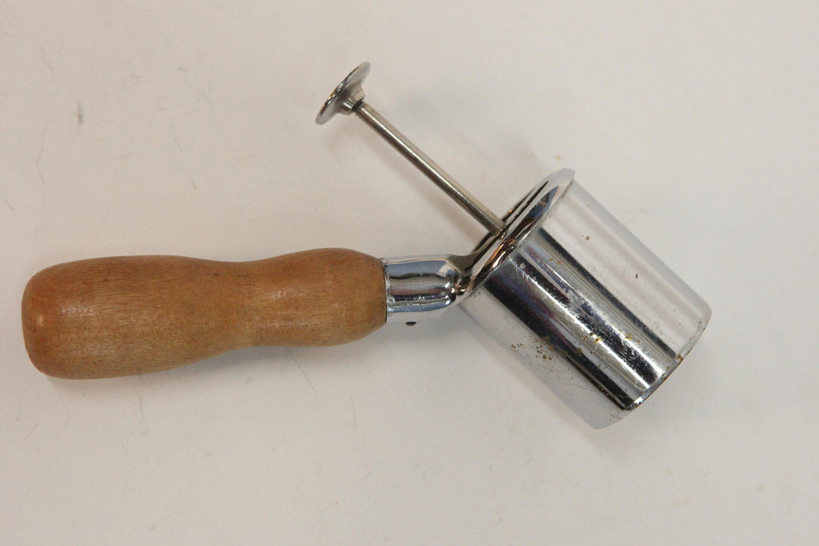 ROWLETTE (?) ICE CREAM SCOOP: Tubular with push rod, metal with wood handle, normal wear, L-7 1/2", VG-EX