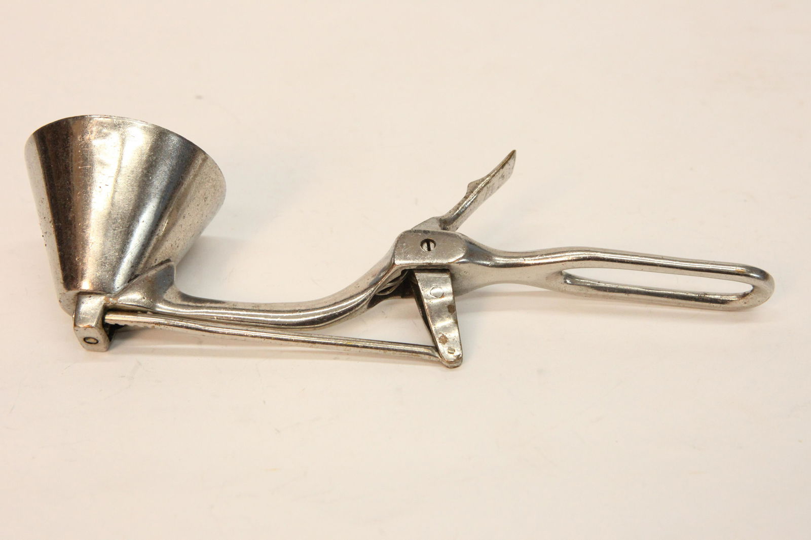 ERIE CONE ICE CREAM SCOOP: All metal, Erie Specialty Co., cone shape, #8, trigger mechanism, some pitting, normal wear, L-10 1/2", G-VG