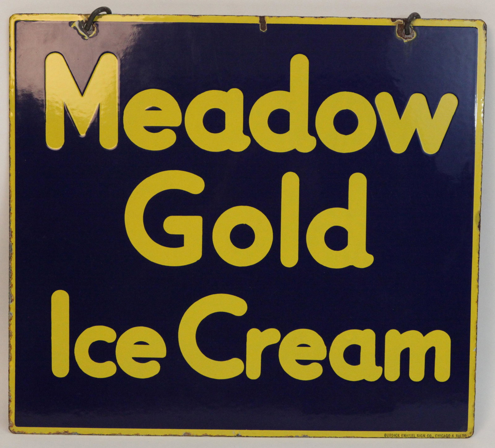MEADOW GOLD ICE CREAM SIGN: Porcelain, double sided, "Burdick Baltimore", edge roughness, chips around mounting holes, (1) top center chip on one side; normal wear; 16" x 18", G-G+