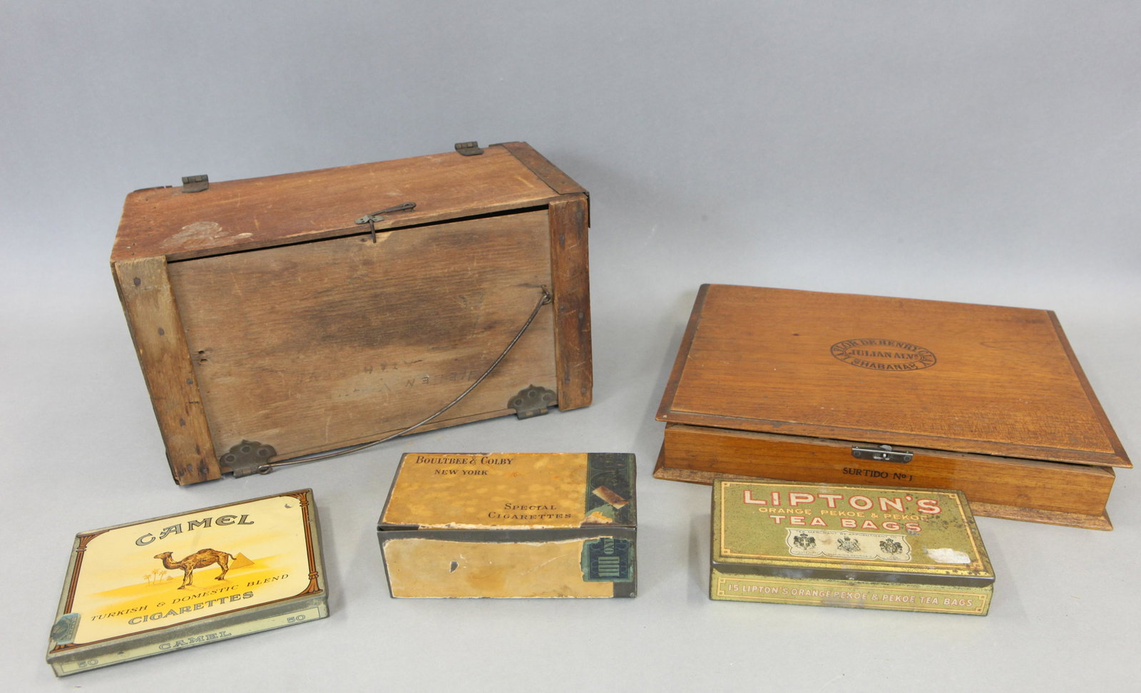 BOXES & ADVERTISING TINS (5): (3) Cigarette and tea tins, (1) cigar shipping box, (1) The Day-Mount Collapsible Carrier, normal wear, longest 12", F-G