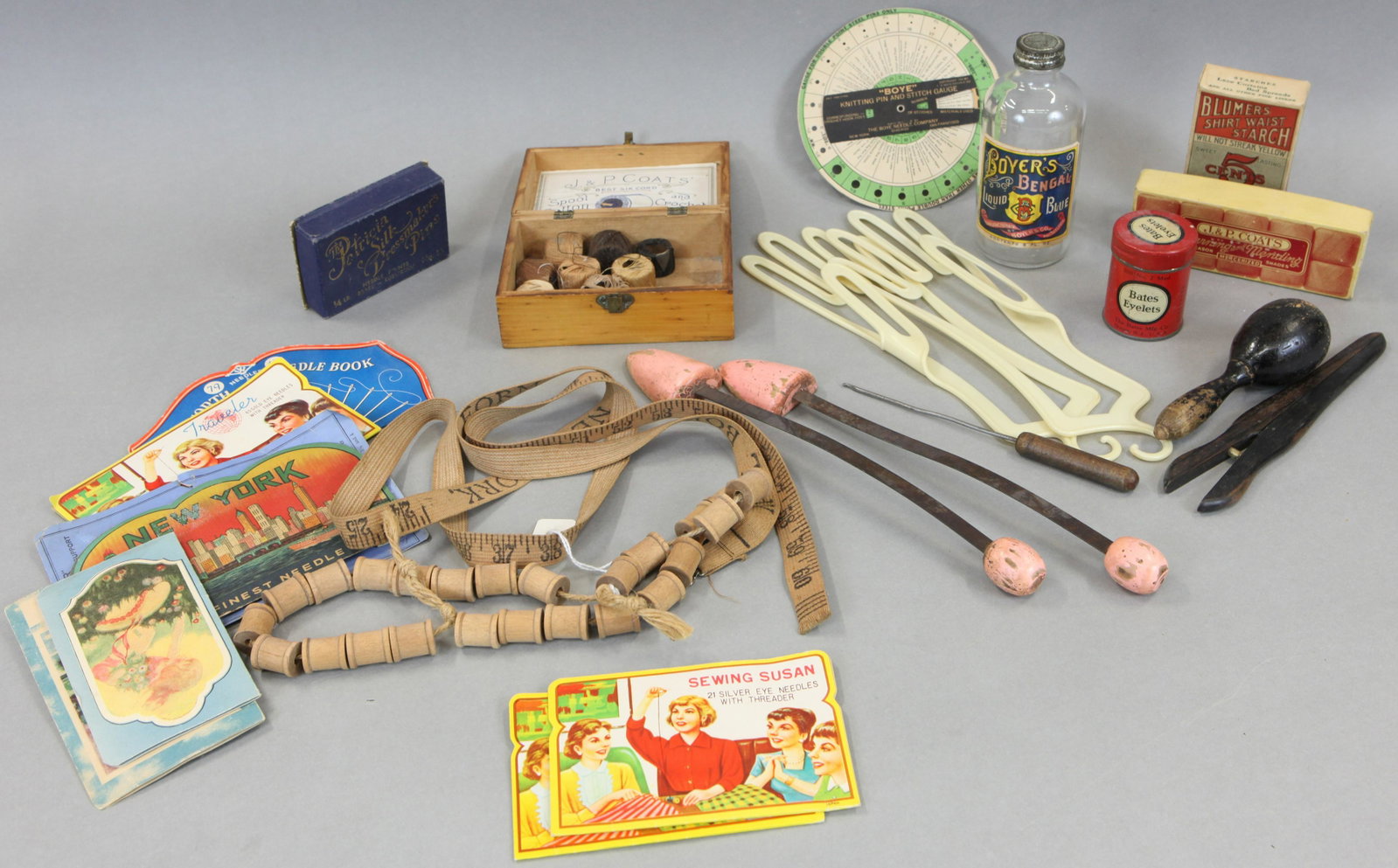 SEWING GOODS: includes: J. P. Coats spool cotton box, advertising cloth measuring tape, Boye knitting pin and stitch gauge, glove stretchers, assorted needle books, product boxes, containers, etc.; normal wear; var