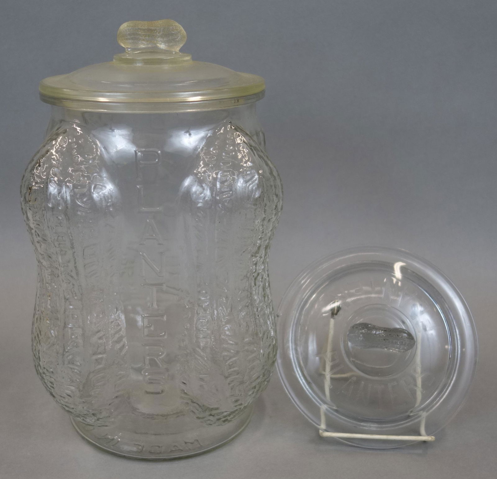 PLANTERS PEANUT JAR: Glass, figural peanuts, (2) peanut, finial loss but only one printed planters; normal wear; H-12"