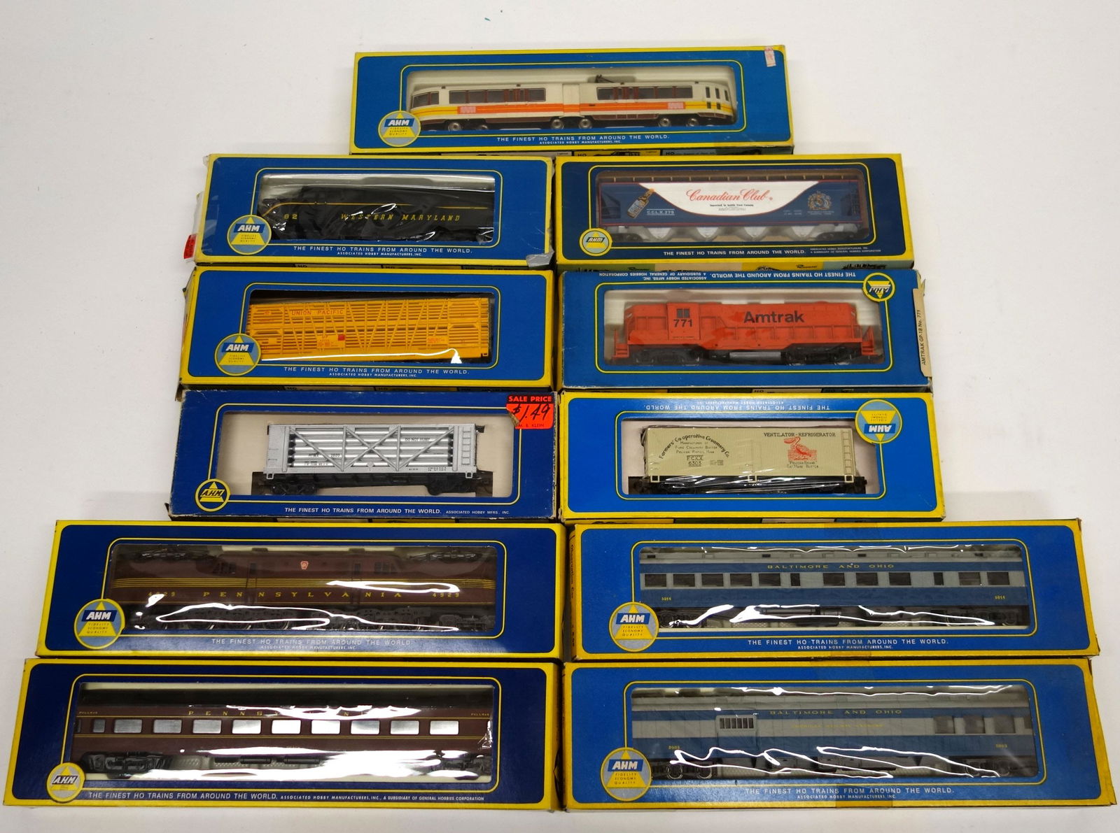 AHM HO SCALE ENGINES & CARS (11): Engines include: PRR, Western MD, Amtrak, cars include: coach car, observation car, stock car, reefer car, combine car, etc., original boxes, longest 13", box damage, G-VG