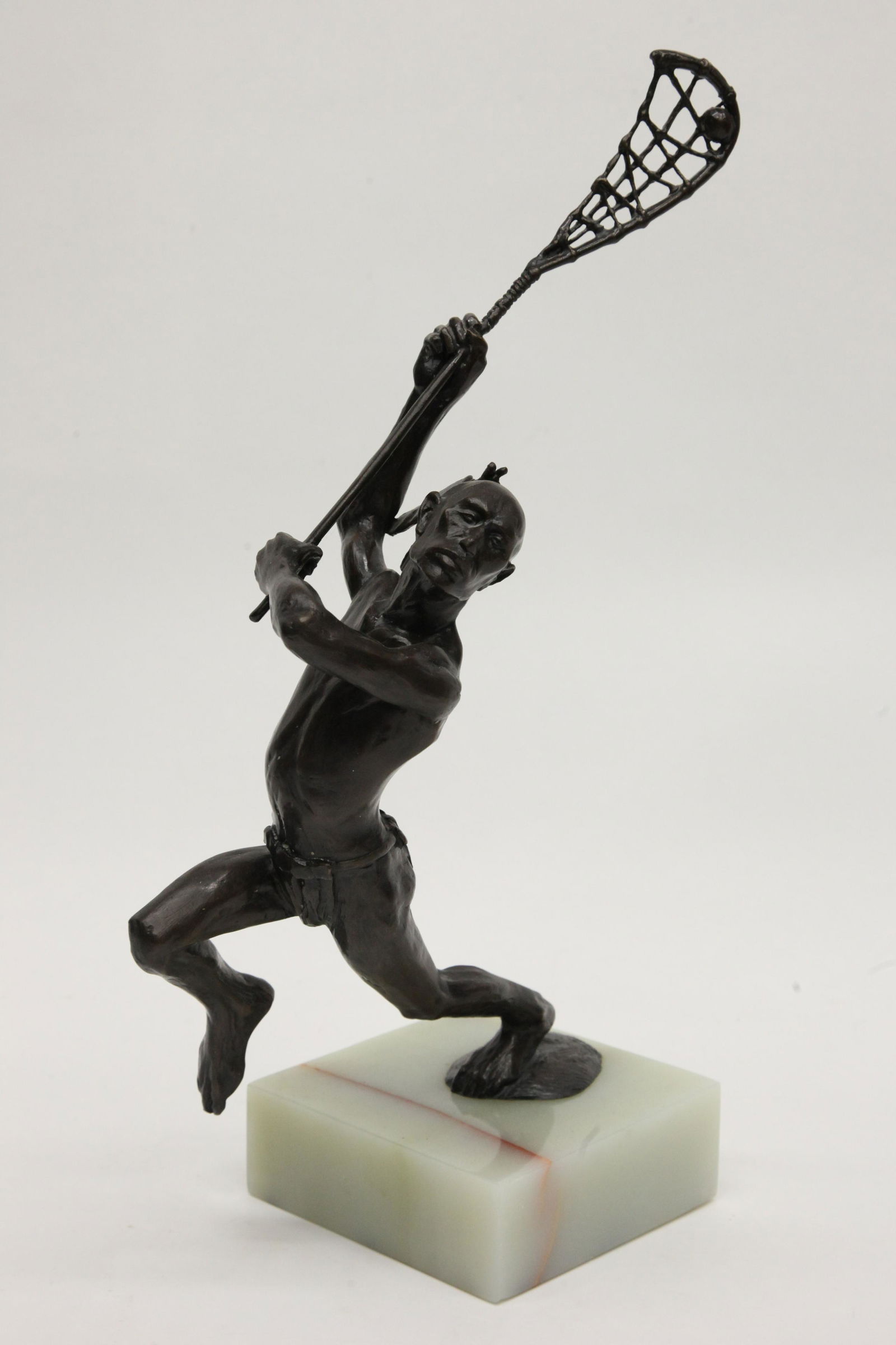NATIVE AMERICAN LACROSSE BRONZE: Contemporary; signed on base, alabaster base, normal wear; H-20", VG-EX