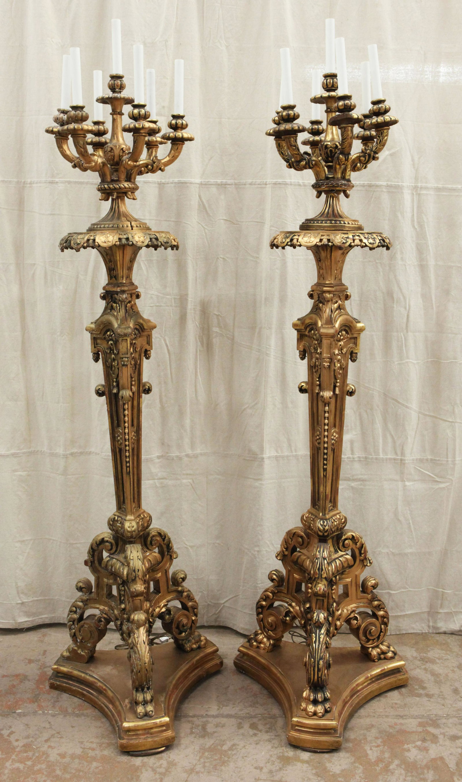 PAIR OF ELABORATE GILT TORCHERES: Rococo style; wood and gilt gesso; (7) light; electrified; some over paint; normal wear; H- 82"; G-VG