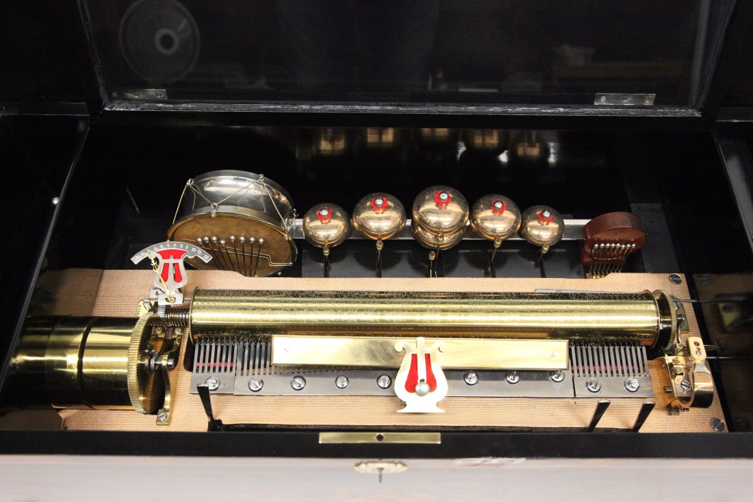 CYLINDER MUSIC BOX: Inlaid case, 12 tune, cylinder, L-17"; bells, drum, castanet, possibly some restoration; plays; normal wear; case H-12", L-31", G-VG