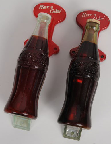 LOT OF 2 COCA-COLA DOOR PULL HANDLES: Each is 7 3/4" x 2", 1950's, one all-plastic version and the other version has the metal interior support and top metal plate; both clean and bright with only a few small marks or nicks in the color; 