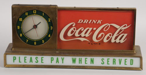 1950's COCA-COLA LIGHTED COUNTERTOP CLOCK SIGN: 9" x 19 1/2"; general overall mild to medium tarnish and toning on the gold painted metal surfaces; lower right glass support is missing, and the glass has dropped a bit; minor flaking on the "L" of "
