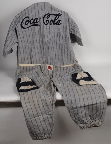 EARLY COCA-COLA BASEBALL UNIFORM: Circa 1920's to 30's, includes short sleeve jersey, pants and socks; the pants and jersey still have the Rawlings tags; light to medium overall wear and soiling; presents very nicely; condition 7.5/VG
