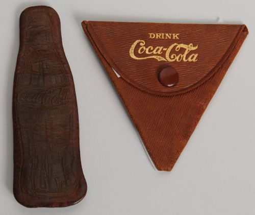 2 COCA-COLA LEATHER CHANGE PURSES: Triangular purse circa 1908, the bottle purse circa 1938; the early purse is ribbed leather and unusual find in this high condition with little to no wear; the bottle purse is also quite unusual and f