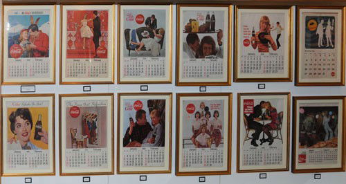 NICE GROUP OF 12 1960'S COKE CALENDARS: All 12 pieces are nicely matted and framed under glass and go from 1960 to 1970 and include 2 different 1968 calendars; most are very clean, bright and unused with only a few exhibiting light wear or