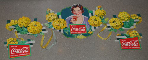 1932 COCA-COLA VERBENA FESTOON: 2' tall and could extend to approximately 10' horizontally if desired; the festoon is clean, bright and beautiful with only minor fold marks at bendable fold tabs, minor edge wear; condition 9.2 to 9.