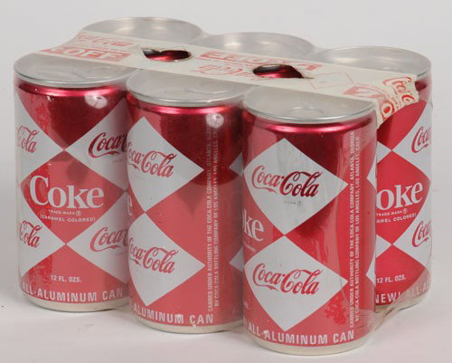 1960'S COCA-COLA DIAMOND CANS 6-PACK: These cans have never been filled or possibly a demonstration model; still retain the original Coca-Cola shrink wrap with top finger holes; light soiling, a few minor scratches and 1 or 2 small dents;