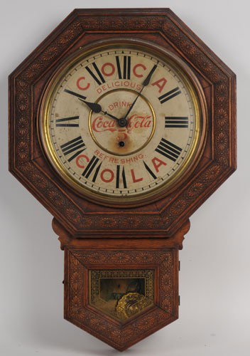 1901 COCA-COLA WELCH OCTAGONAL CLOCK: 27" X 18"; still retains its original cardboard bottom insert; featuring the girl with yellow roses in the bottom of the clock; this clock displays very well with only light to moderate stains and soi