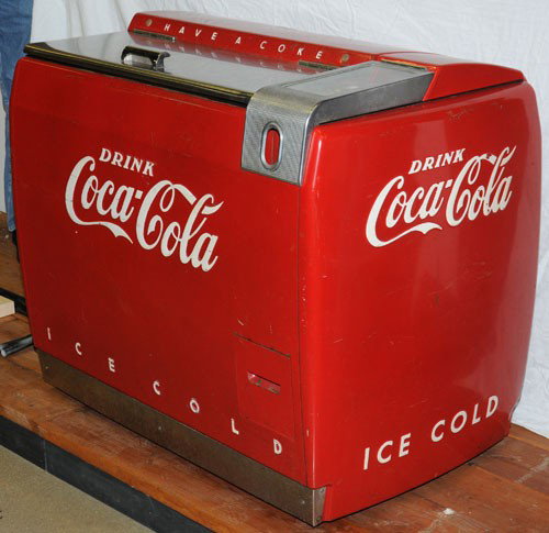 1940'S COCA-COLA 6 CASE MASTER COOLER: Westinghouse model WE6; all four sides feature embossed lettering; interior features internal light; missing back handle and bottle opener; moderate overall marks, wear and scratches; with a larger sh