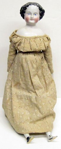 EARLY CHINA HEAD DOLL: Early flat top china (rubs to hair and cheeks) and original body (leaking); original lower arms, beautiful hands, lower legs (paint worn); early costume; H-19 1/2", G
