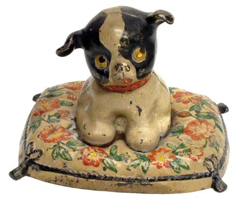 FIDO PUP ON PILLOW DOORSTOP: Painted cast iron; some crazing, some chips and wear; L-7 1/2", VG-EX