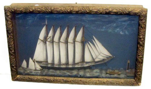 SHIP DIORAMA: Primitive style; large carved wood 6-masted boat with (2) smaller boats and lighthouse; painted burlap waves and painted background; Victorian molded gilt shadow box frame; total: 17" x 28", G