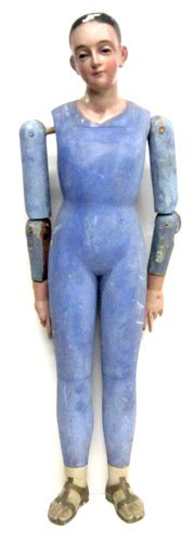 EUROPEAN RELIGIOUS FIGURE: Carved and painted wood with glass eyes; jointed arms; damage and loss to fingers and right forearm; normal wear; (3) bolts extend from back; H-34", G