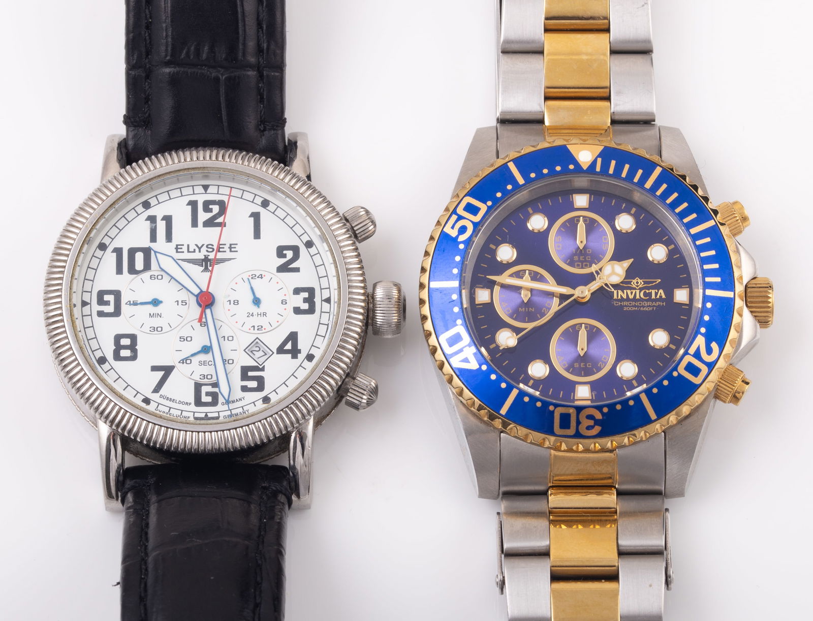 (2) MEN'S DESIGNER WRIST WATCHES: Water resistant, stainless steel; (1) Invicta Chronograph, blue face with two-tone band; (1) Elysee, German, black leather band; leather band shows some wear; longest 10", G-VG