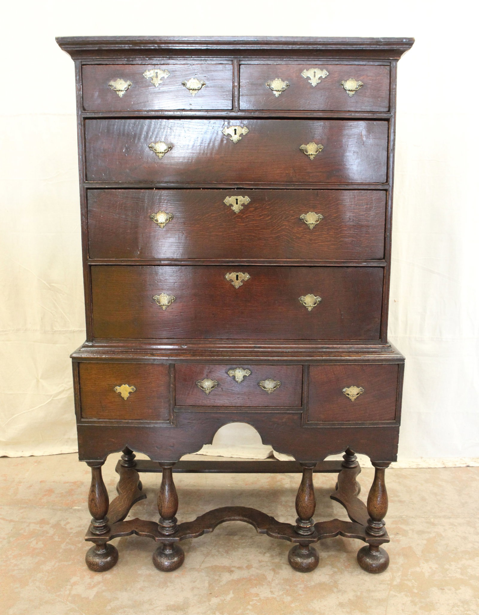 ANTIQUE WILLIAM & MARY HIGHBOY: Two piece, oak, top has two over three, paneled ends; base has three small central drawers, six turned legs with stretcher, normal wear, H-64", L-38 1/2", G-G+