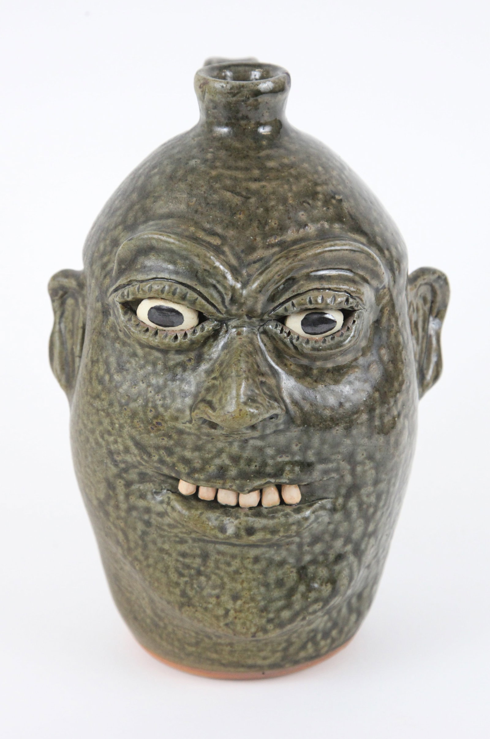 GROTESQUE FACE JUG: Stoneware; bottom signed "Gleater & Billie Meaders 8-24-1995", H-11 1/4", VG-EX