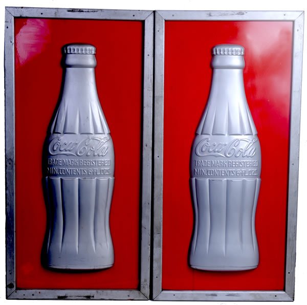 2 COCA-COLA 1940S TIN BOTTLE SIGNS: 48" x 24". Both are as manufactured with embossed bottles mounted on a flat metal background with original wooden framework. The better sign has only light marks and frame wear with a few small nicks