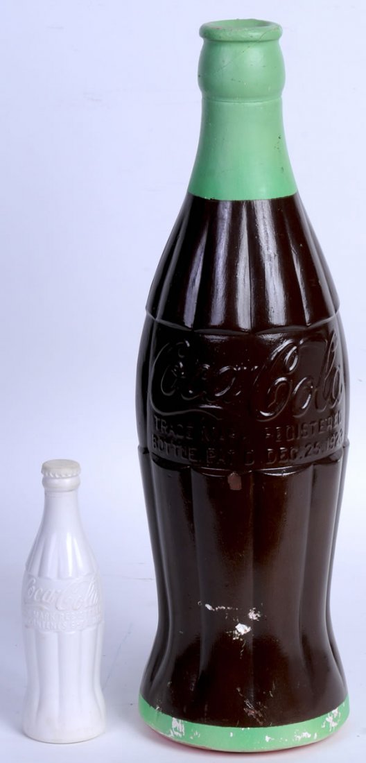 MILK GLASS AND CHALKWARE COCA-COLA BOTTLES: 8" and 20" tall. Circa 1930s. The small bottle has only small marks and light wear/soiling, while the large bottle has a few scratches and surface nicks. Both are a bit unusual to find. Condition 7.5