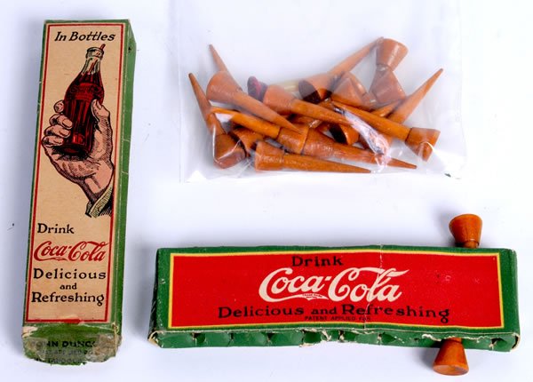 RARE PAIR OF 1920S COCA-COLA GOLF TEE DISPENSERS: Side bends and tape on ends of the version with hand and bottle. Strong bends on the red version and small tape residue on end panels. Quite unusual to find! Condition 6.5 to 7.5 / G-VG