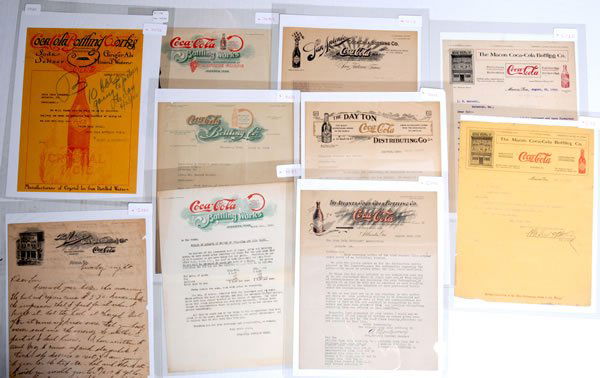 10 ASSORTED COCA-COLA LETTERHEADS: Most are 11" x 8 1/2" and date from circa 1900 to 1920. Some strong and bold graphics with some wonderful old buildings are included in this group. Light to moderate overall wear and soiling with some