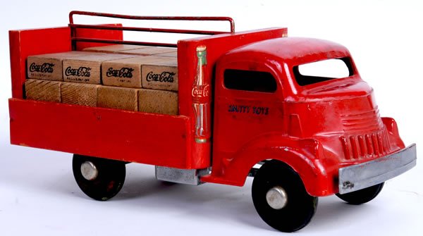 COCA-COLA SMITH MILLER DELIVERY TRUCK - 1940's: 13 1/2" long. Marked "Smitty Toys". The truck is an aluminum cab with wooden body and 8 stamped "Coca-Cola" blocks with 8 unstamped blocks. There is decal loss to the decals on the body, and otherwise