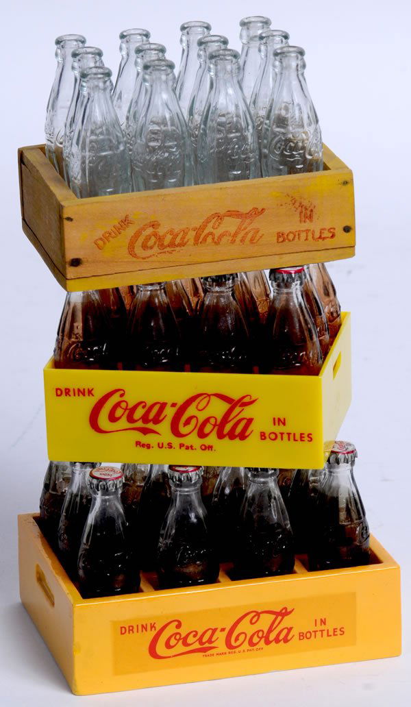 3 COCA-COLA MINIATURE 12 BOTTLE CASES: 3" x 4 1/2" x 3 1/4" deep largest case. 1940s-50s. One wood, one plastic, and one ceramic. All bottles are glass and caps are metal and printed. Good details and only light wear. Condition 9 to 9.5 /