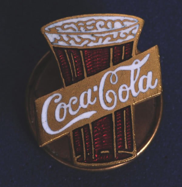 CIRCA 1912 COCA=COLA CLOISONNE LAPEL PIN: 5/8" X 1/2". This pin still retains original screw-back and marked Whitehead and Hoag. A beautiful small pin which is wonderfully made. Condition is very high with little to no wear noted. Condition 9