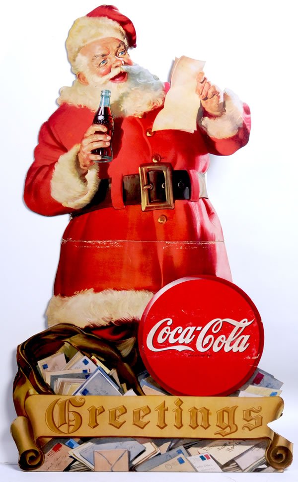 1945 LARGE COCA-COLA SANTA CUTOUT: 50" x 30" Separated at fold line at waist, but still has easel back. Small chunk is missing lower right area and mild wear and rubs. Condition 7 /VG