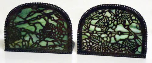 RIVIERE STUDIOS BOOKENDS: Filigree bronze with green stained glass; both pieces of glass cracked; L-5", F