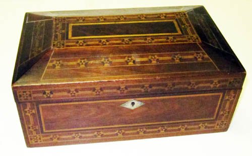 INLAID WORK BOX: Mahogany and mixed wood; geometric inlaid band design; lined interior with sliding tray; minor checking; L-12"; VG
