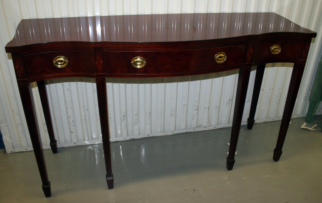 BAKER HEPPLEWHITE HUNT BOARD: Charleston reproduction; mahogany with shaped top; oval and line inlay; H-35 1/2", L-60", VG-EX