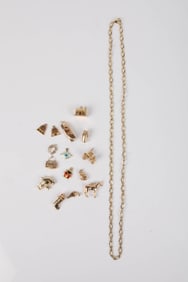 14K GOLD NECKLACE and ASSORTED GOLD CHARMS