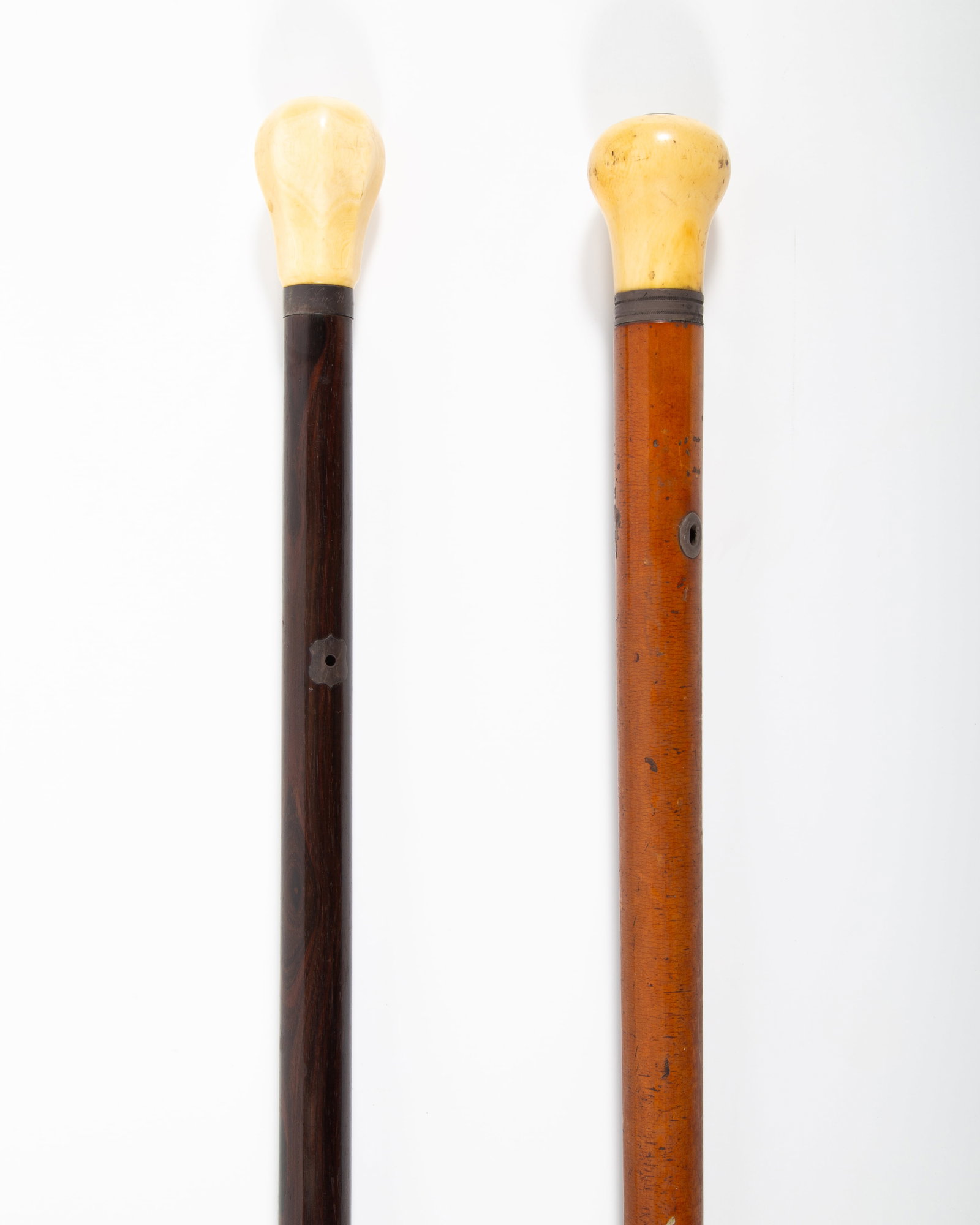 ANTIQUE WALKING STICKS: Knob handles; metal ferrules; (1) engraved "John Warner Smith NY"; rosewood shaft; (1) Malacca shaft; normal wear; L- 34" - 36": G-G+
