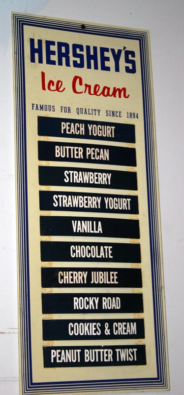 HERSHEY ICE CREAM FLAVOR SIGN: Plastic sign with cardboard flavors; H-26 1/2", L-11", VG-EX THIS WAS USED AS A MOVIE PROP