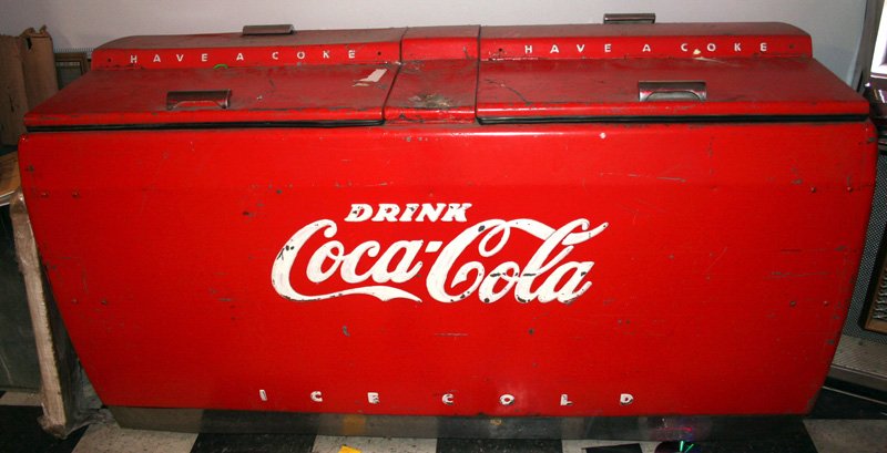 CAVALIER COCA-COLA CHEST COOLER: Old repaint; part of top corroded; cracks, chips; missing bottle catchers; H-35", L-69", P