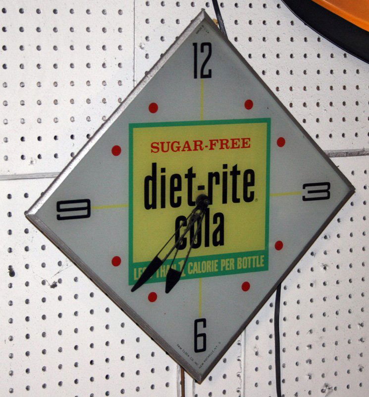 DIET-RITE COLA LIGHTED CLOCK: Diamond shaped clock, backlight with Diet-Rite logo; does not light up; H-21 1/2", G-VG