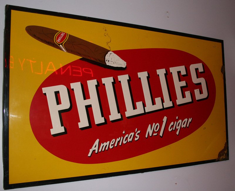 PHILLIES CIGAR SIGN: Embossed painted sheet metal; great graphics; central image is attractive, however; (2) areas of rust on right edge and lower right corner; 34" x 58", G