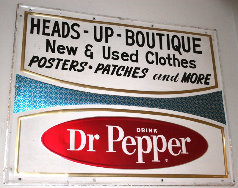 DR. PEPPER COLA SIGN: Embossed litho tin; quite graphic and reads, "Heads Up Boutique"; self framed; scratching and minor warping; 47" x 58", VG