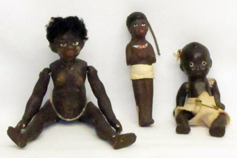 (3) BLACK AMERICANA DOLLS: (1) Native doll: unmarked painted papier mache, jointed; (1) Native doll: German painted papier mache with spring atop head; (1) baby doll: Japan, painted bisque; jointed; large papier mache doll has 